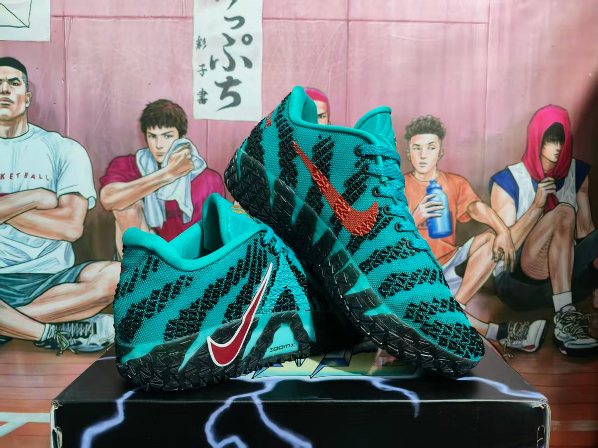 Pair of teal and black Nike basketball sneakers displayed on a shoebox, showing the patterned upper, contrasting Swoosh and black outsole.