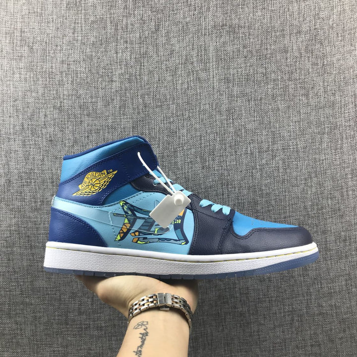 Side view of a blue and navy Jordan mid-top sneaker with light-blue panels, graphic detailing and yellow wing branding.