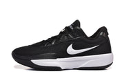 Side profile of a black Nike sneaker with a white side logo, white midsole, and black outsole.