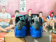 Rear view showing perforated blue heels, black padded collars, and visible Flight branding.