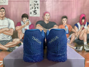 Rear view of the blue sneakers showing TWELVE lettering on the heels.