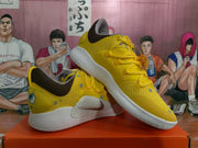 Angled view of the pair showing the yellow uppers, SpongeBob heel artwork, grey details, and white outsoles.