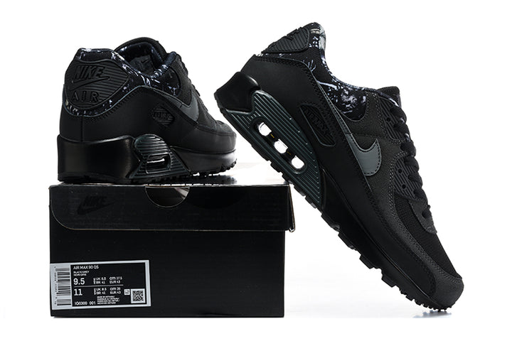 Black Nike Air Max 90 sneakers shown with a black shoe box; the box label shows a US Men’s 9.5 sample size.