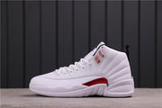 Side profile of the white and red sneaker showing its high-top shape, laces, and black heel trim.