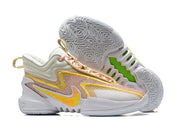 Light grey and cream Nike Anthony Edwards 2 basketball shoes with yellow accents.