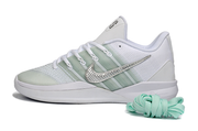 Profile of a white and silver Nike Sabrina 3 shoe with pale green accents