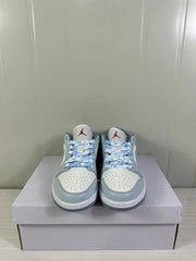 Front view showing the white perforated toe boxes, blue-grey overlays, and blue laces.