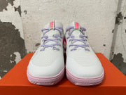 Front view of white Nike basketball shoes with lavender laces and pink outsoles
