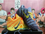Angled view of orange/yellow and blue/navy mismatched basketball shoes.