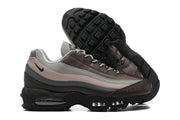 Nike Air Max 95 sneakers showing layered sides and black tread outsole