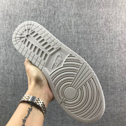 Underside view showing the circular traction pattern and segmented rubber outsole.