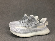 Pair of white and grey low-top sneakers displayed together from a three-quarter angle.