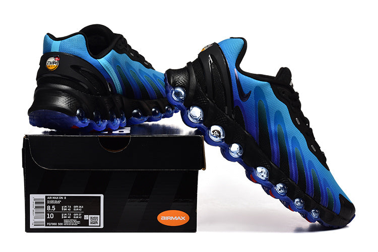 Blue and black Air Max DN sneakers displayed with a shoe box; the box label shows a sample size.