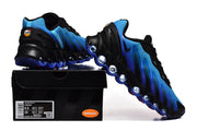 Blue and black Air Max DN sneakers displayed with a shoe box; the box label shows a sample size.