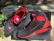 Top and side view showing the red interior lining, padded collars, and lace-up construction.