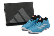 Blue shoes displayed beside a dark shoebox