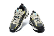Front and top views of the pair of chunky sneakers with lace-up fronts and contrasting accent colors.