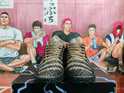 Front view of brown and black Nike basketball sneakers with patterned uppers, brown laces, and black textured soles.