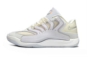 Side view of white and silver Nike KD 18 basketball sneakers.