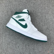 Single side view highlighting the green Swoosh and winged basketball emblem.