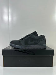 Side profile of a dark grey and black low-top sneaker