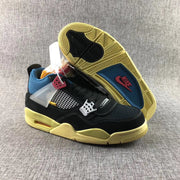 Sneaker angled to show the patterned yellow-toned outsole, black traction sections, and blue insole area.