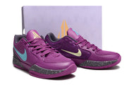 Pair of purple Nike Ja 2 shoes displayed in front of a shoe box