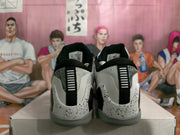 Rear view showing black heel pull tabs, gray heel panels, and speckled white heel midsoles.