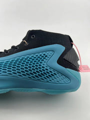 Rear side detail showing black upper, blue side panel, and pink tag