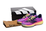 Pair of purple and pink adidas shoes displayed with a shoebox and paper bag.