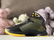 Opposite side view showing the black upper, yellow outsole, lace-up front, and high-top collar.
