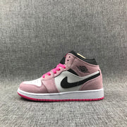 Side profile showing the pink and white upper, black side branding and bright pink outsole.