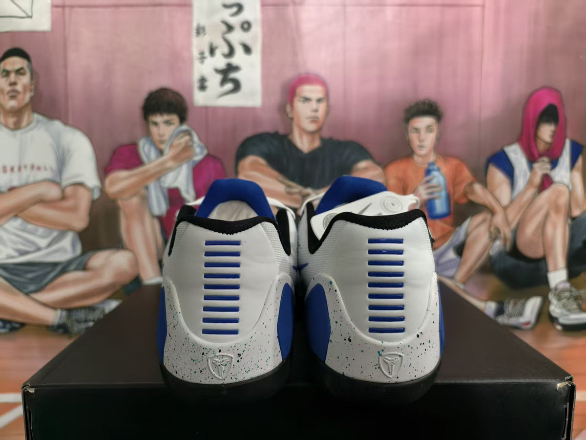 Rear view of white and blue Nike sneakers showing blue heel accents, horizontal heel details, and speckled midsoles.