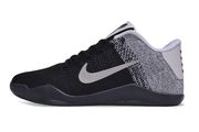 Side profile of the black and white Kobe 11 sneaker.