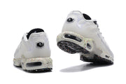Rear views of the sneakers showing heel details and speckled soles