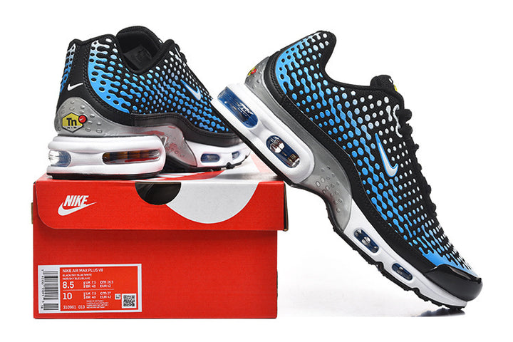 Pair of black, blue, and white Nike Air Max Plus VII sneakers displayed on a Nike shoe box; box label shows a sample size.