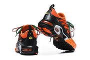 Nike Air Max Plus sneakers shown from the heel and outsole.