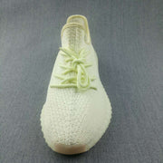 Top view showing the lace arrangement, textured toe box, and rounded sneaker shape.