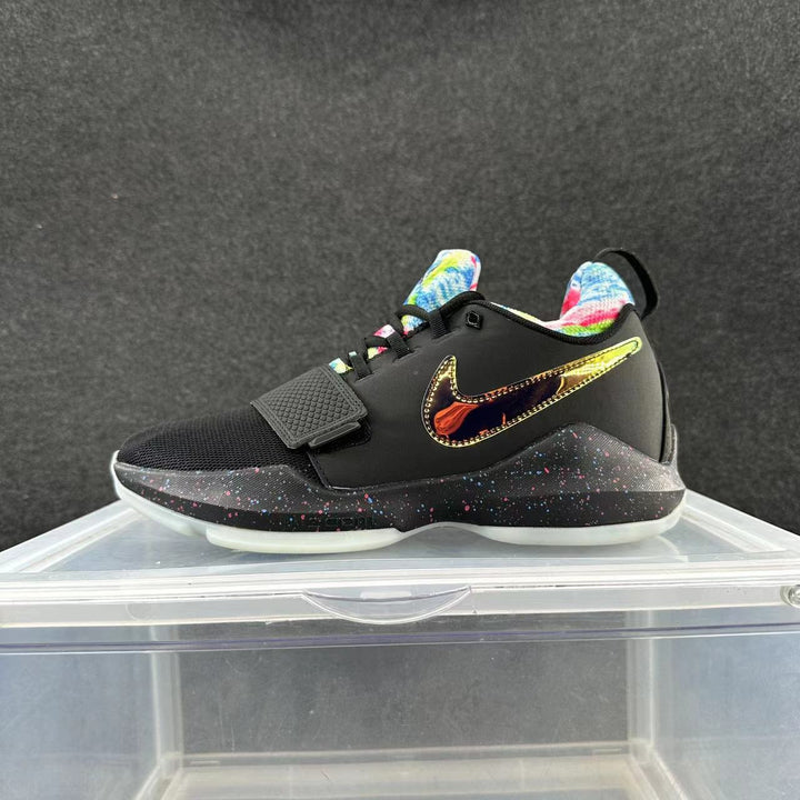 Black Nike basketball shoe with a gold-tone side Swoosh, colorful lining, forefoot strap, and speckled midsole.