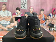 Rear view of black basketball sneakers showing LeBron and Nike branding on the heels