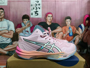 Side view of a pink and gray ASICS Sky Elite FF 3 shoe with iridescent stripes and a contrasting outsole.