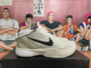 Side view of white and light gray Nike All-Star 2.0 basketball sneakers with black Swoosh and a raised star pattern.