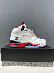 Side profile of a single white, red, and black high-top sneaker displayed on a box.