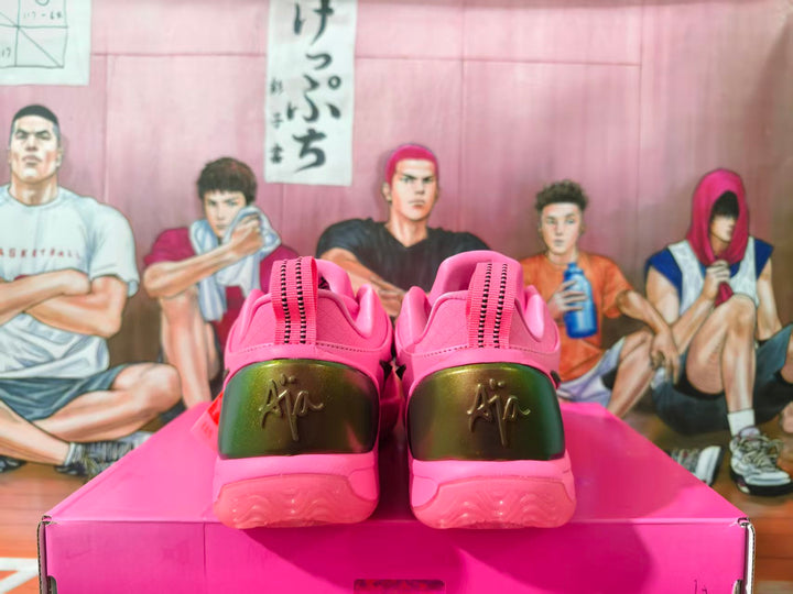 Rear view of bright pink Nike sneakers with metallic gold-tone heel panels