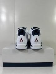 Rear view showing the padded navy collar, white heel panels, and red Air branding.