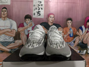Front view of the pair showing white laces, black-and-white patterned toe boxes, and black outsoles.
