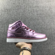 Side view of a pink rose and burgundy high-top Jordan sneaker with a white outsole.