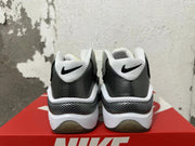 Rear view of grey, white and black Nike sneakers with patterned heel panels