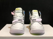 Front view of the pair showing white laces, padded tongues, ankle straps and black tongue branding.