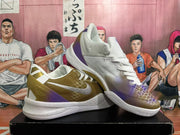 Pair of white basketball shoes with purple and gold gradient detailing, shown from the side and front
